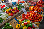 View of fruit stall selling tomatoes and peppers on market near bus station, Port Louis, Mauritius, Indian Ocean, Africa