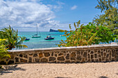 View of boats and turquoise Indian Ocean on sunny day in Cap Malheureux, Mauritius, Indian Ocean, Africa