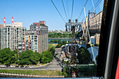 View of the Roosevelt Island Tramway, the first commuter aerial tramway in North America, that spans the East River and connects Roosevelt Island to the Upper East Side of Manhattan, New York City, United States of America, North America