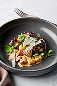 Handmade potato gnocchi, Swiss brown & shiitake mushrooms, porcini cream, shaved pecorino, rocket leaves, purple basil