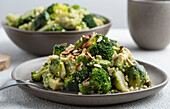 Warm salad of broccoli, Brussels sprouts and avocado with almonds