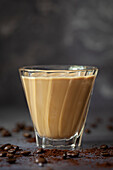 A Spanish latte made with espresso coffee, milk and condensed milk served in a heatproof glass.