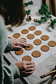 Baking Christmas almond butter biscuits with candlelight in an atmospheric style