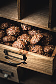 Chocolate Oatmeal Cookies in a wooden drawer