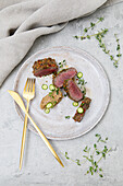 Lamb belly, peas, with herb-crusted roast potato puree