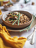Oatmeal and mushroom risotto in a ceramic bowl