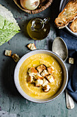 Potato and cabbage soup with croutons
