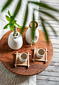 Japanese sake still life with a bamboo branch, light-coloured linen background, Asian ceremony