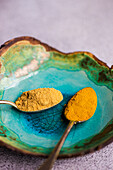 Vintage spoon with powdered spices such as ginger and turmeric