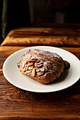 Almond croissant on a wooden table