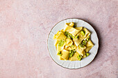 Plate of appardelle with pesto on the table