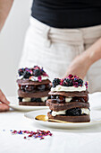 Black Forest gateau with layers of chocolate cake, cherries and whipped cream