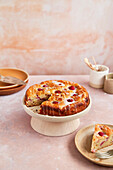 Raspberry Ricotta Cake with Icing on Stand with slice