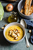 Potato and cabbage soup with croutons