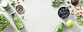 Vegetarian vegan healthy ingredients and green smoothie on grey stone background. Healthy food, eco-friendly, zero waste concept banner