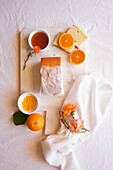 Orange Madeira cake with syrup and orange peel. Table decoration for afternoon tea flatlay