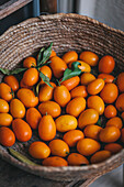 Fresh kumquats in a basket