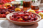 Crawfish party, cooked Louisiana, with corn on the cob, potatoes. Crawfish cooked in Cajun spices and herbs.with beer, New Orleans, Classic Cajun or Creole cuisine