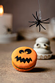 Jack o lantern macaron over table for Halloween