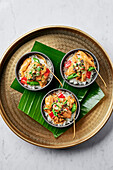 Malaysian style red chicken curry with pineapple & kaffir lime salsa on steamed rice