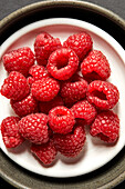 Raspberries on a white plate