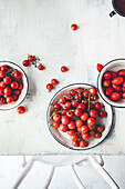 Tomatoes on the vine on a table with copy space