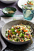 Palestinian couscous in a grey bowl