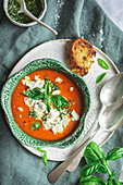 Roasted Tomato Soup with goat cheese in a cabbage shaped bowl