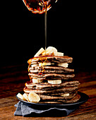 Stack of Vegan Sourdough Buckwheat Pancakes on a Plate with Banana