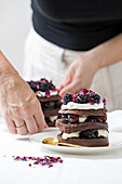 Black Forest gateau with layers of chocolate cake, cherries and whipped cream