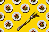 Sausages with Green peas on plate on yellow background Seamless pattern