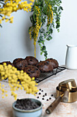 Chocolate bread with tahini spread on a table with yellow flowers