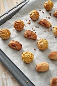 High angle of sweet panellets served on tray placed on wooden table