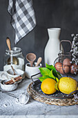 Ceramic bowls and vase near napkin placed on marble table against gray background at rustic kitchen