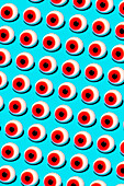 Vibrant vector illustration of eyeballs with red irises placed in parallel rows against blue backdrop