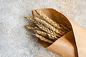 High angle of summer table setting with wheat against gray table