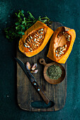 Raw pumpkin and ingredients for cooking healthy lunch dish