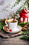 Winter hot tea with spices and lemon in the cup