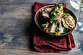 Traditional georgian boiled meat with coriander herb served in the bowl