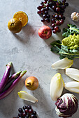 Food concept, flat lay with fresh fruits and vegetables on gray background with copy space