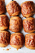 Top view of delicious homemade baked pain au chocolat placed on white background in bakery