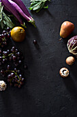 Food concept, flat lay with fresh fruits and vegetables on dark background