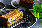 Gourmet slice of honey cake served on ceramic plate