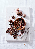 Opening walnuts with a cracker top view. White background