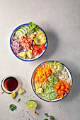 From above tasty salmon poke on white bowls