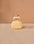 Natural sponge under eco friendly brush with soap bar and mineral on two color background