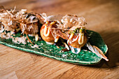 Stock photo of delicious plate of sushi with special sauces.