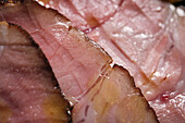 Closeup view of juicy piece of delicious ham prepared for appetizing ramen dish