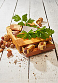 Ripe green parsley and sharp knife on wooden cutting board set