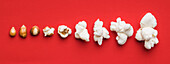 Closeup of some popcorn on a red background